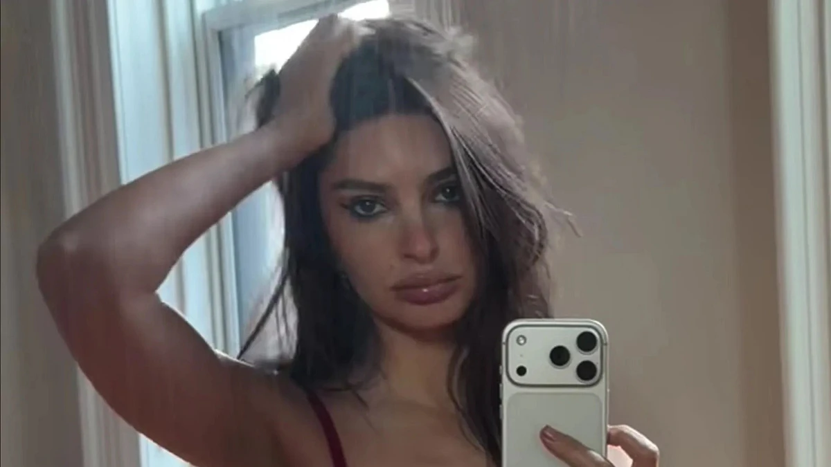 Emily Ratajkowski rocks spicy red lace lingerie as she squats down on the floor