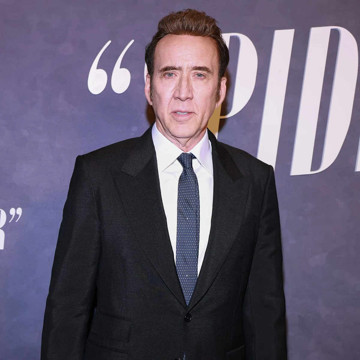 Nicolas Cage Looks Nearly Unrecognizable With Gray Beard and Hair on Red Carpet