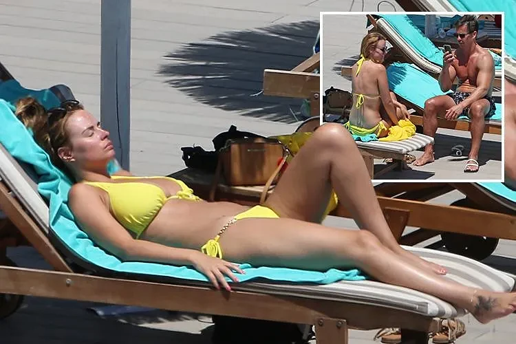Rhian Sugden wows in a bright yellow bikini as she sunbathes with boyfriend Oliver Mellor in Ibiza