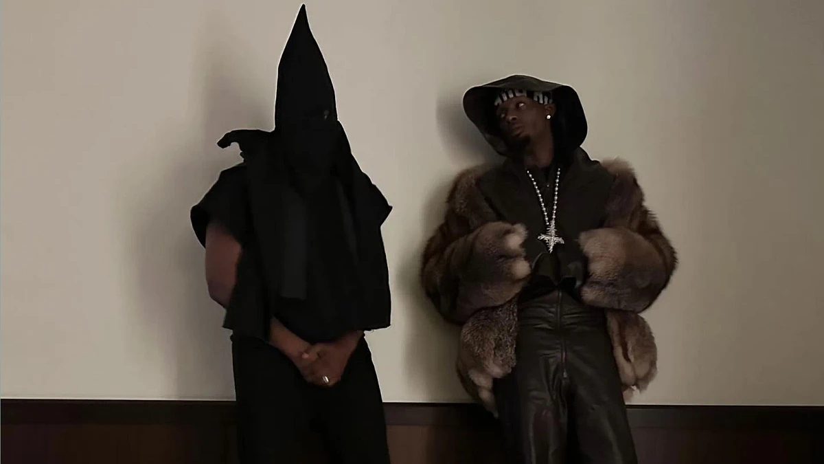 Kanye West infuriates fans by wearing black 'KKK hood' at Vultures party in Miami with kids North, Saint, and Chicago